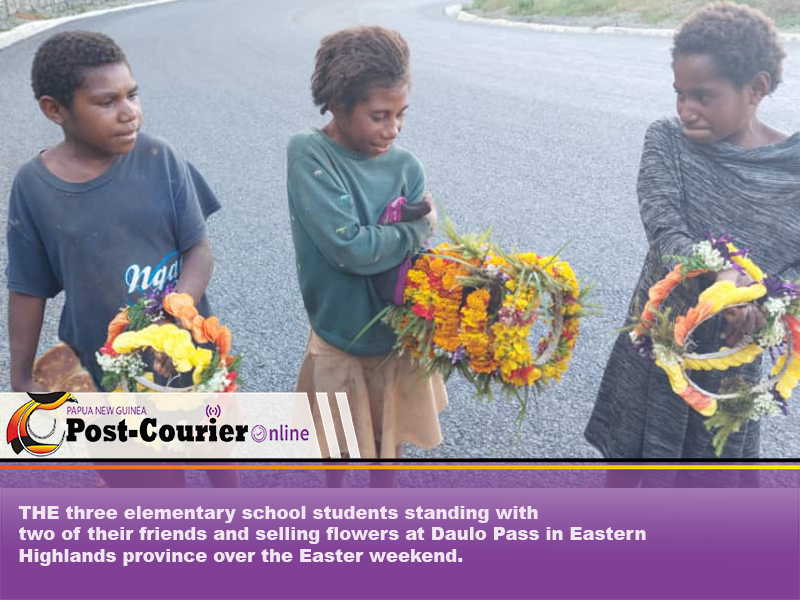 Elementary students sell flowers for lunch money